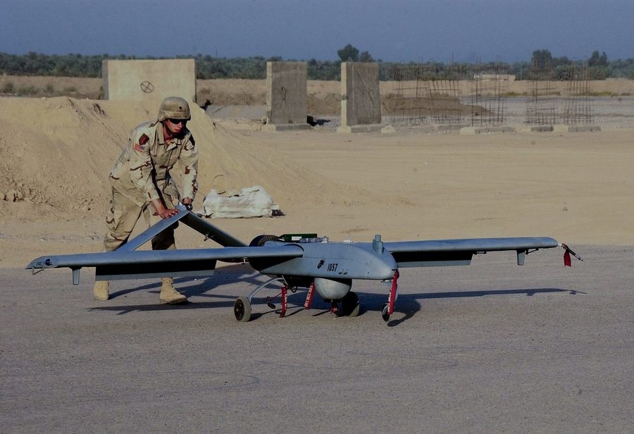 A fixed-wing unmanned aircraft on a prepared surface before launch.